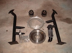 NEW Engine Mounting Kit to install 1998 and up 06A/038 Style 4-Cylinder Gasoline/Diesel Engine into T3 Vanagon in upright 15-Degree configuration. Comes with New Special Flywheel and Adapter Plate, Hydraulic Motor Mounts and all new nuts/bolts. Uses Stock 228mm Vanagon Clutch (not included). Can also be used on earlier 068, 028 and 058 style engine blocks with some modification of the right side steel mounting bracket seen in pic to the right of flywheel